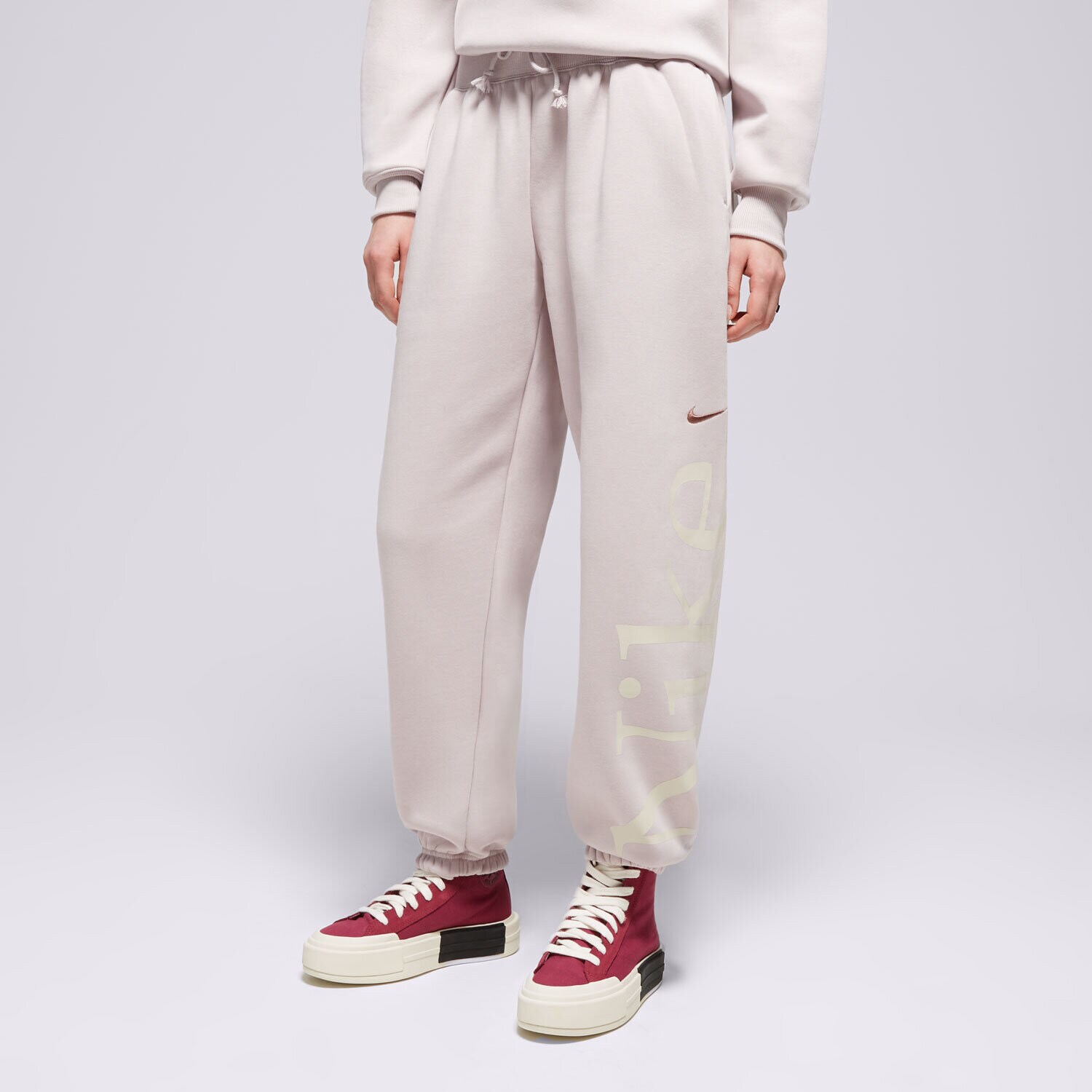 Ženske hlače NIKE HLAČE W NSW PHNX FLC OS LOGO SWTPNT FN2552-019 vijolična