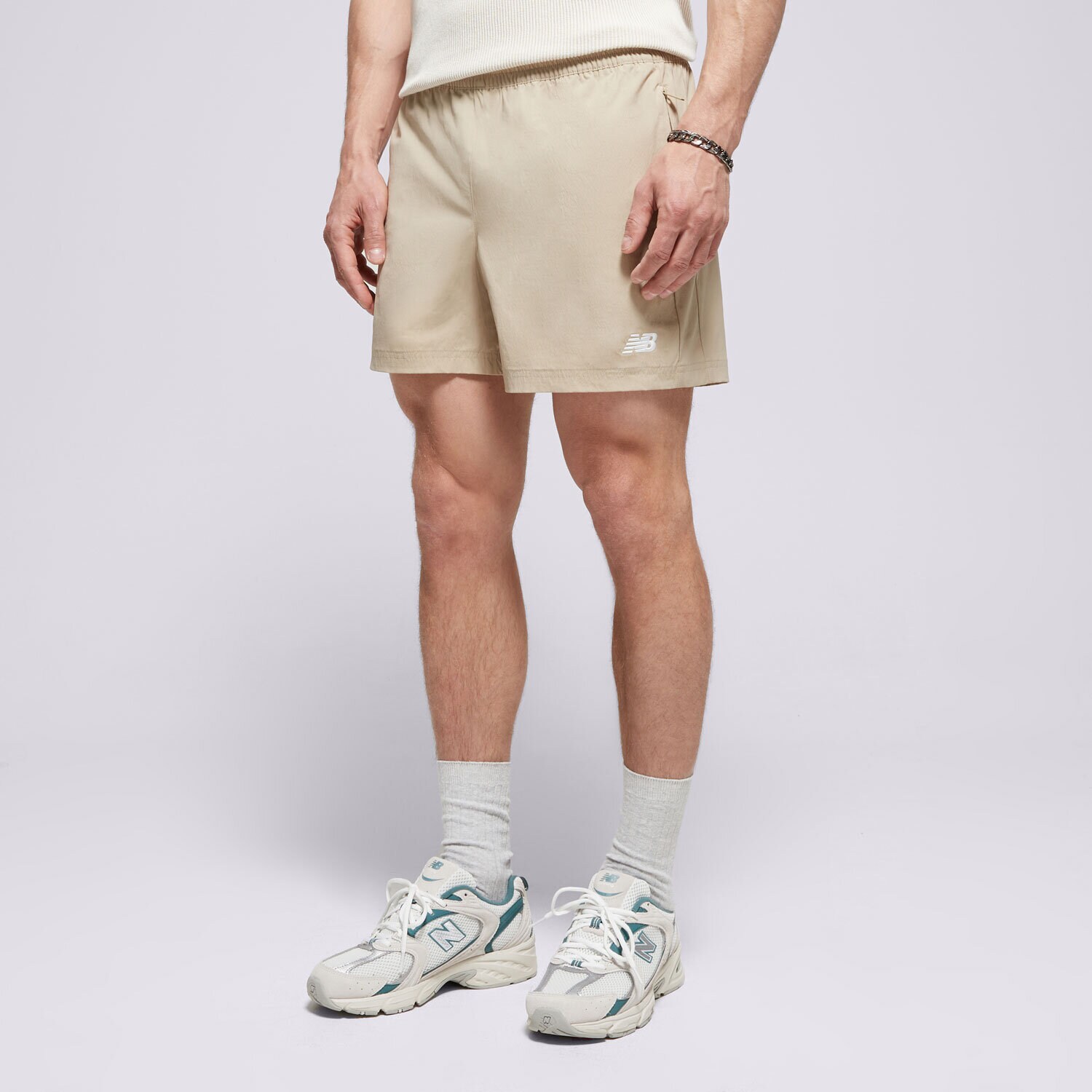 Moški kratke hlače NEW BALANCE KRATKE HLAČE ATHLETICS   STRETCH WOVEN SHORT MS41517SOT bež