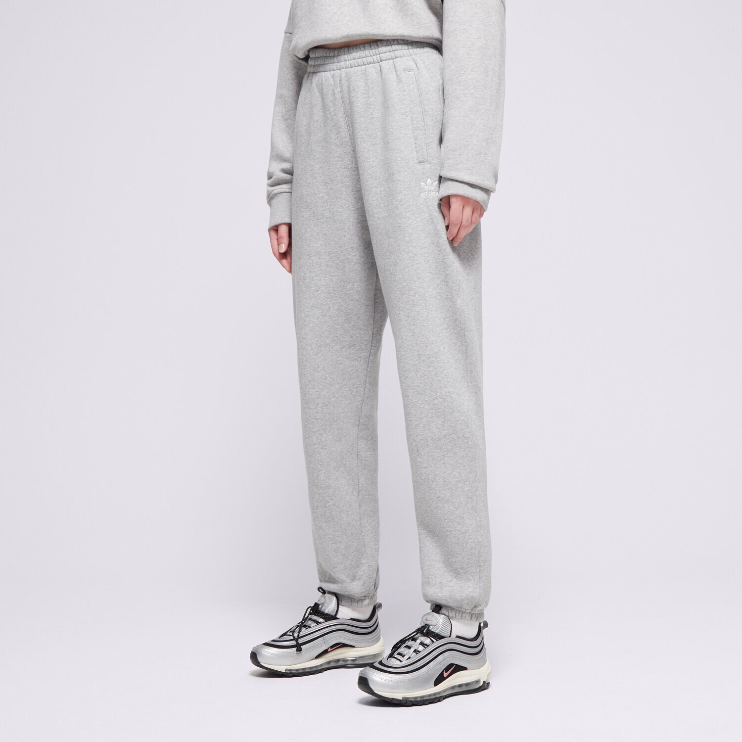 Ženske hlače ADIDAS HLAČE ESS JOGGERS IY9638 siva