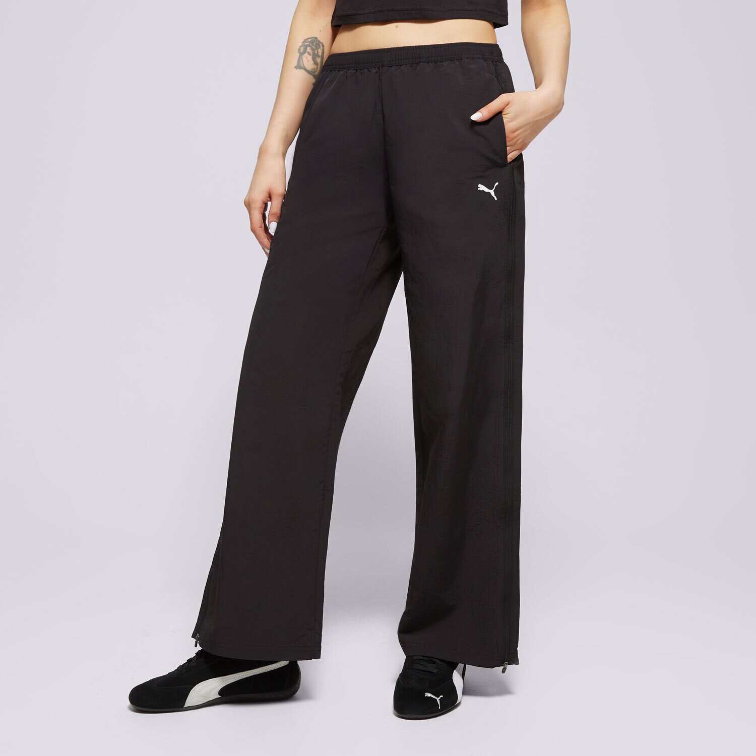 Ženske hlače PUMA HLAČE RELAXED WOVEN ZIP-OFF PANTS OP 629808 01 črna