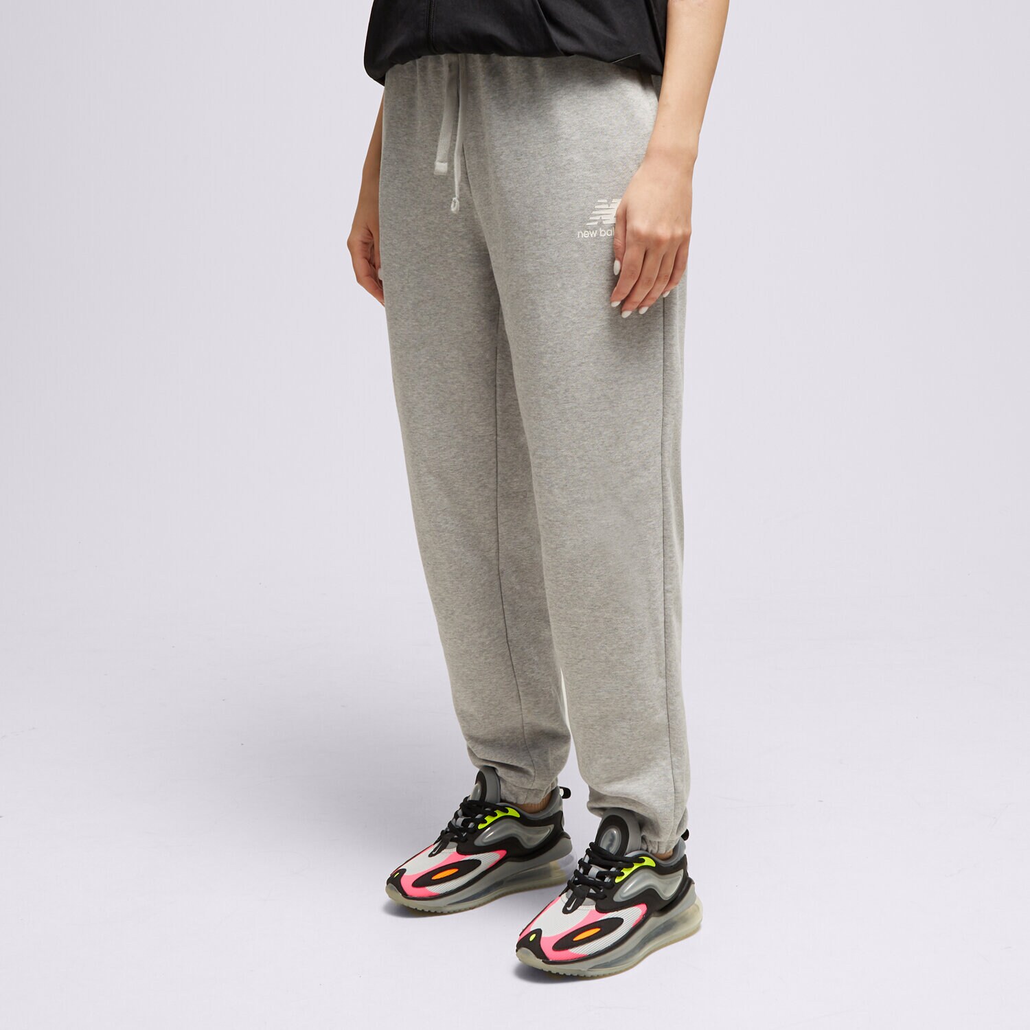 Ženske hlače NEW BALANCE HLAČE NB ESSENTIALS STACKED WP31530AG siva